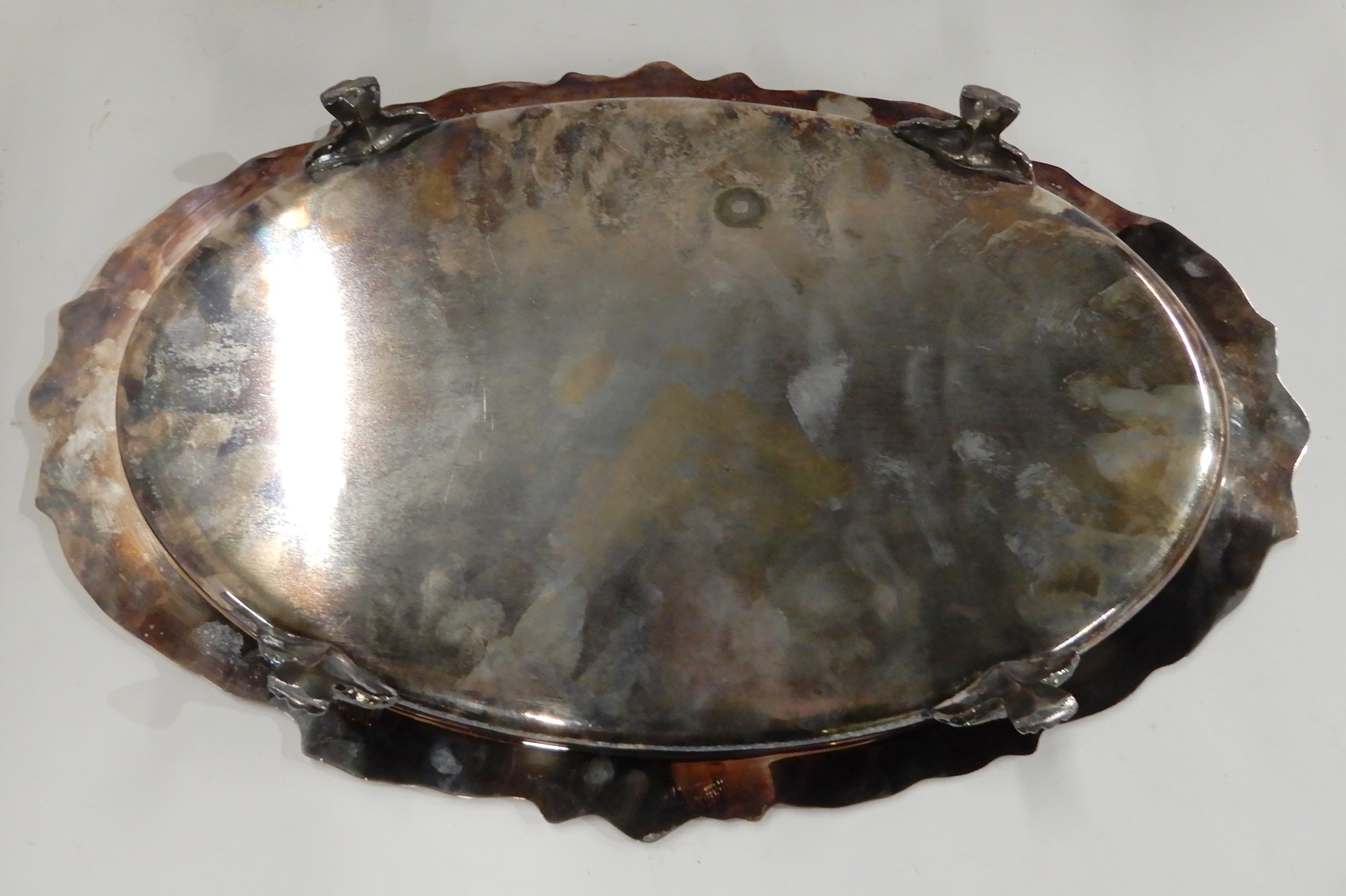 A silver plated serving dish, oval shaped on four scrolling feet, 50cm x 32cm Condition Report: - Image 3 of 3
