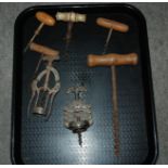 Six various corkscrews and large example (7) Condition Report: Available upon request