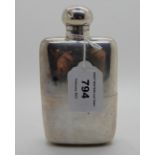 A silver spirit flask, rubbed London marks, 14cm x 7.8cm, 236gms Provenance: The Late Dr Helen. E.