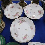 A Limoges porcelain dessert service printed with flowers comprising six plates, four serving bowls