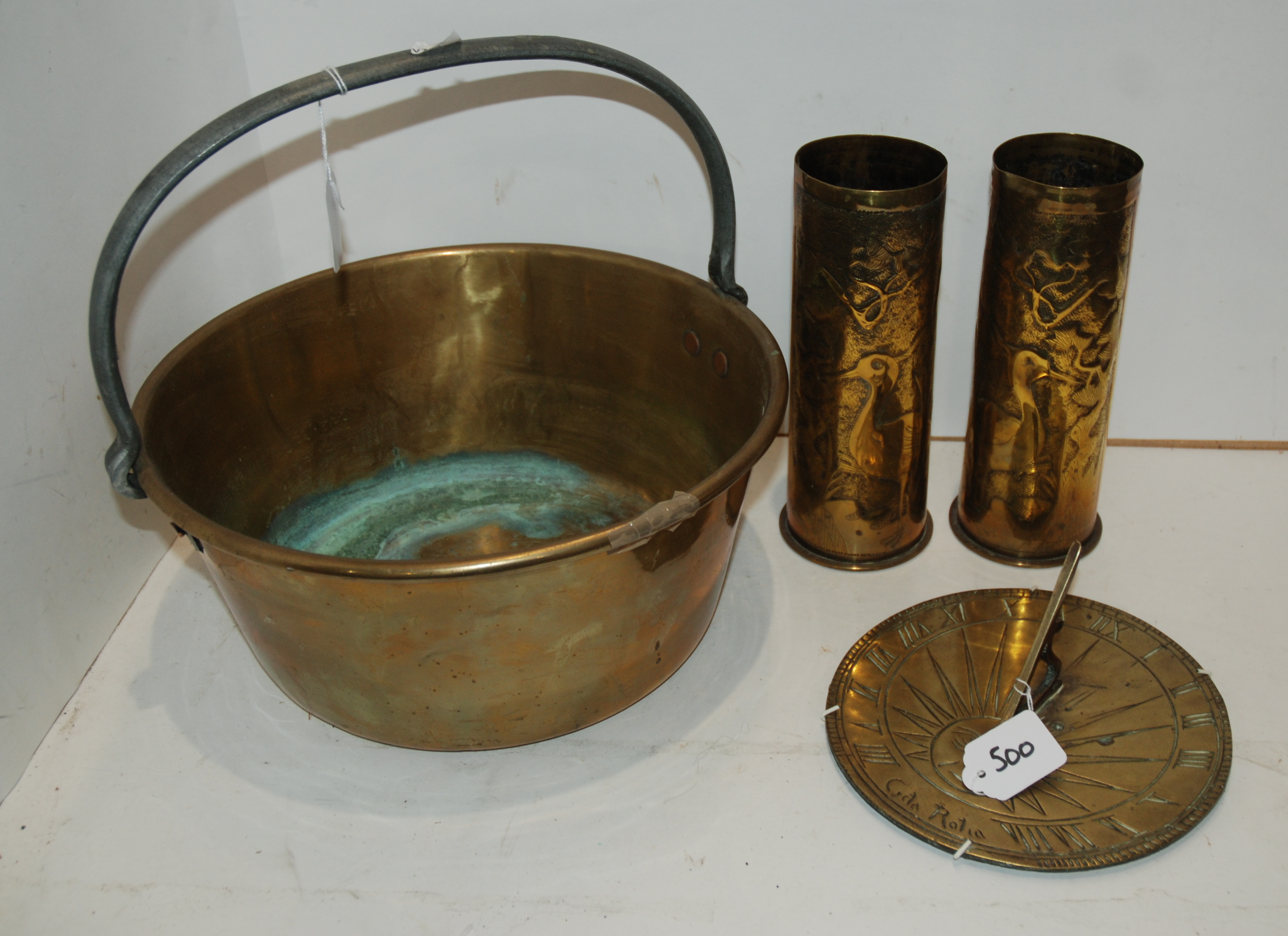 A brass jelly pan, pair of trench art vases, 22.5cm high, sundial, 20cm wide and small cane, 68cm