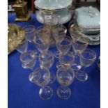 A suite of eight cut and gilded wine glasses and six smaller glasses, together with a jug with