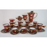 A Rosenthal Versace Medusa coffee set in orange and black colourway, comprising coffee pot, milk