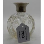 A silver topped scent bottle, Birmingham 1908, 10cm high Condition Report: