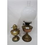 A brass oil lamp and another lamp Condition Report: Available upon request