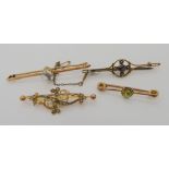 A 9ct moonstone bar brooch, a yellow metal peridot and pearl brooch and two further 9ct pearl set