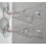 A pair of 20th Century air twist wine glasses, indistinctly signed to base, 22cm high Condition