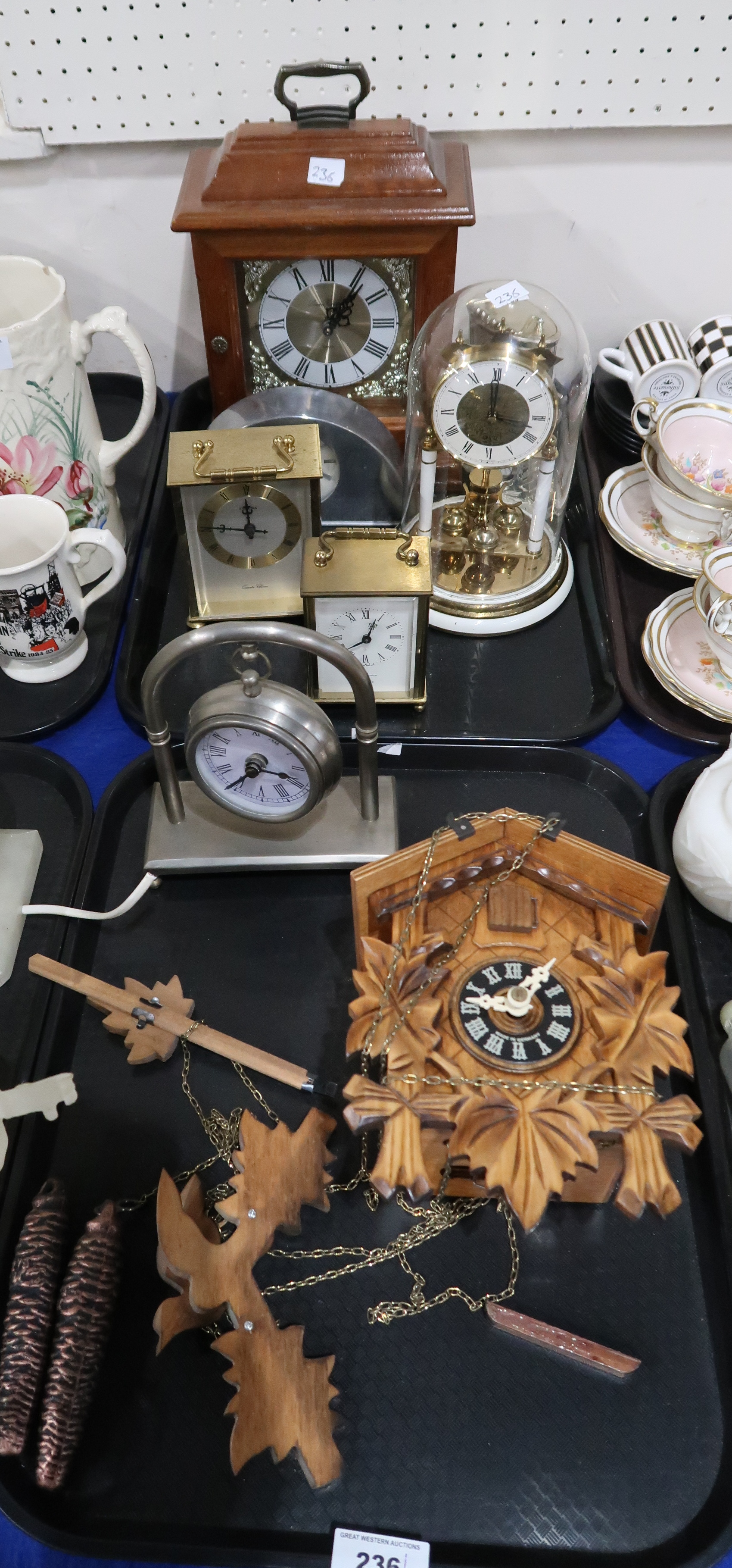 A collection of clocks including a cuckoo clock Condition Report: Not available for this lot