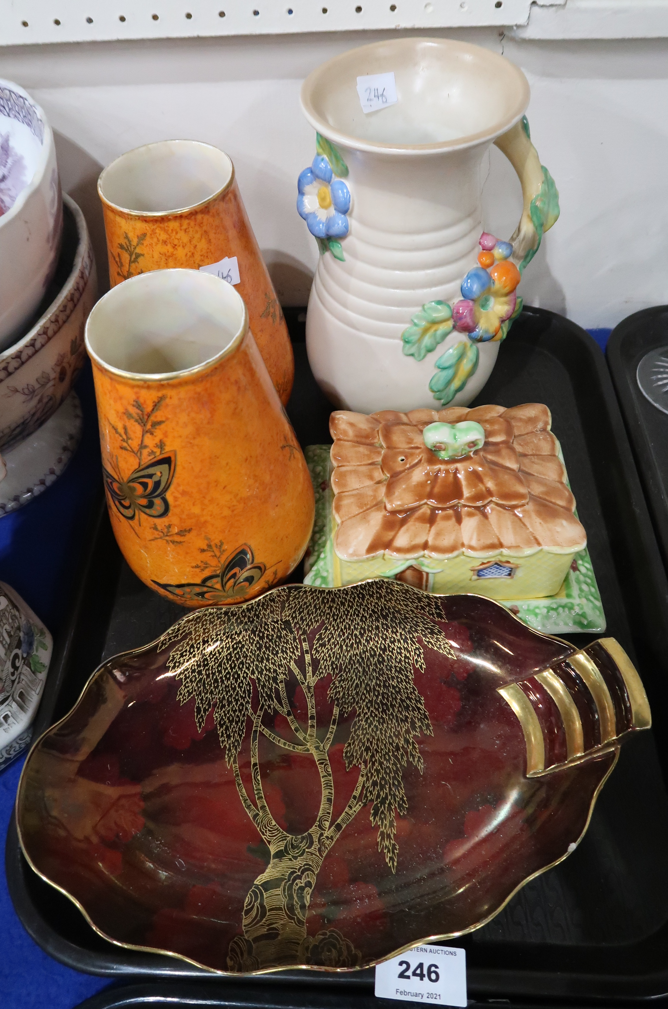 A pair of Crown Devon orange ground vases decorated with butterflies, a moulded Clarice Cliff