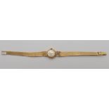 A 9ct gold ladies Walker & Hall wristwatch (strap as found) weight including mechanism 19.4gms