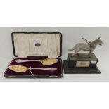 A lot comprising a cased pair of silver gilt plated berry spoons and a Guide Dog trophy