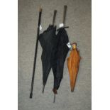 Two white-metal parasols, small umbrella and walking cane, (def) (4) Condition Report: Available