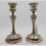 A pair of silver candlesticks, Birmingham 1917, 17.5cm high, weighted Condition Report: Not