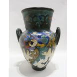 A large Gouda two handled vase with floral decoration, 32cm high Condition Report: cracked.