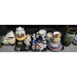 A collection of ceramics including a fairy house night light, large fruit decorated biscuit jar,