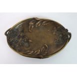 A GILT BRONZE TWO HANDLED DISH decorated with flowers and foliage, signed A Bouny, impressed 1028 BD