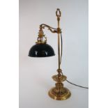 A GILDED METAL DESK LAMP the base with lions heads and swags of flowers, with a green enamel