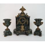 A 19TH CENTURY GREEN MARBLE CLOCK GARNITURE the clock ormolu mounted with flower encrusted tazza and