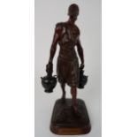A FRENCH BRONZE FIGURE OF A MAN modelled carrying two jars, bears plaque inscribed 'Prix de Rome',