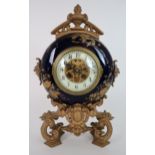 A LATE 19TH CENTURY BREVETE GILT METAL AND PORCELAIN CASED CIRCULAR CLOCK the blue ground with