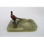 A COLD PAINTED BRONZE PHEASANT modelled standing on an onyx base, 17cm x 12cm Condition Report: some