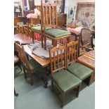 A mahogany extending dining table, 76cm high x 212cm wide x 102cm deep and six dining chairs with