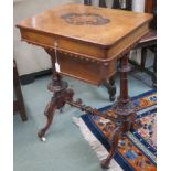 A Victorian walnut inlaid sewing table with carved supports, 73cm high x 56cm wide x 43cm deep