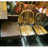 A set of four wheel back windsor chairs, 88cm high and another chair (5) Condition Report: Available