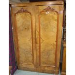 A Victorian mahogany two door wardrobe with fitted interior, 203cm high x 136cm wide x 62cm deep