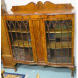 A mahogany display cabinet with two glazed bow front doors,134 cm high x 120cm wide x 35cm deep