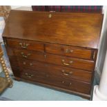 A Georgian mahogany bureau with two over three drawers on bracket feet, 104cm high x 118cm wide x