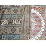 An Eastern bed cover, 50xm x 54cm and another larger decorated with dogs and script, 232cm x 204cm