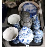 A pair of old Delft jars and covers, a pair of Delft vases, plaques, platters, a stoneware jug etc