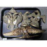 A pair of brass eagle bookends, an eagle door knocker and an ormolu eagle mount Condition Report: