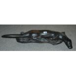 SCOTTISH SCHOOL Otter, carved hardwood sculpture, 81cm long Provenance: The Late Dr Helen. E. C.