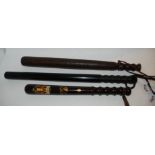 A painted hardwood truncheon, 38cm long and two other hardwood truncheons, 50cm long (3) Condition