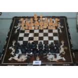 A mother of pearl inlaid chess board and later pieces Condition Report: Available upon request