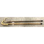 As silver-topped cane and another cane (2) Condition Report: Available upon request