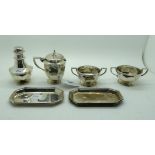A lot comprising a 4 piece silver condiment set, London 1909 & 1910 and a pair of small trays 11.5cm