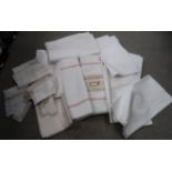 A quantity of assorted table linen, bed covers & sheets, some embroidered examples, doilies etc