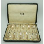 A cased set of six silver coffee spoons and six silver cake knives by Liberty & Co. Birmingham