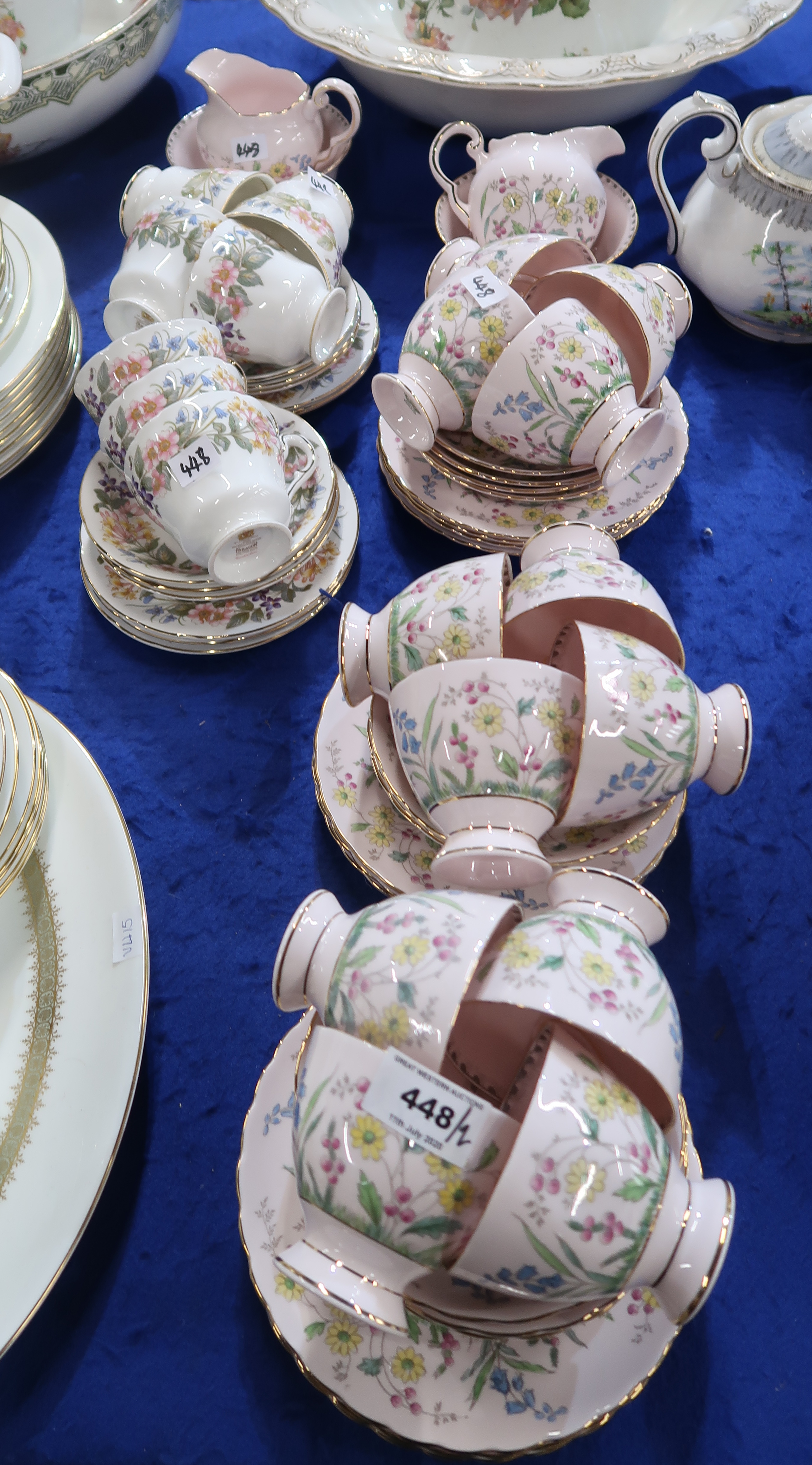 A Tuscan China teaset, the pink ground with flower decoration, comprising twelve cups, saucers and