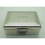 A silver cigarette box London 1934, the hinged cover initialled "MJWH" 12cm x 9cm Condition