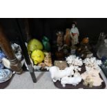 A selection of carved wooden figures and animals, a geisha figurine, a Matryoshka doll, A Koma