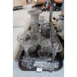 A selection of cut glass and crystal including decanters, ewers, rosebowls, candlesticks, a