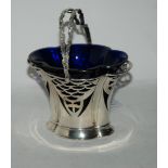 A silver sugar bowl with blue glass liner, Birmingham 1903 15 cm high to top of handle 120 grams