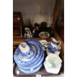 A selection of blue and white transfer printed wares including jugs, plates and bowls, a Limoges