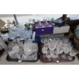 A large quantity of cut glass and crystal drinking glasses, a boxed decanter & glass set by Royal