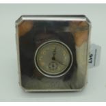 A metal cased pocket watch in silver travel case Birmingham 1922 9.5cm sq. with canted corners