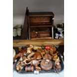 A selection of carved wooden animal figures, a pipe rack and assorted smoking pipes etc Condition